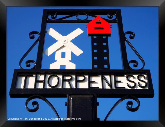 Thorpeness Village Sign showing the Windmill and House in the Cl Framed Print by Mark Sunderland