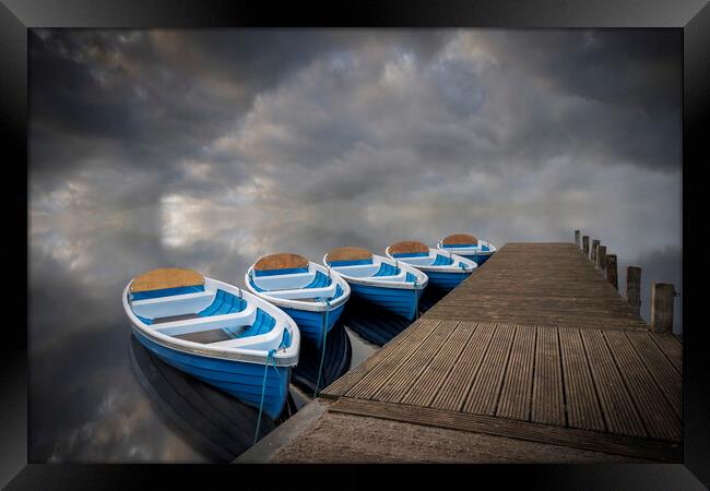 Rowing boats on calm waters Framed Print by Alan Le Bon