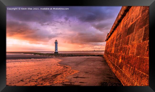 Lighthouse sunset Framed Print by Kevin Elias