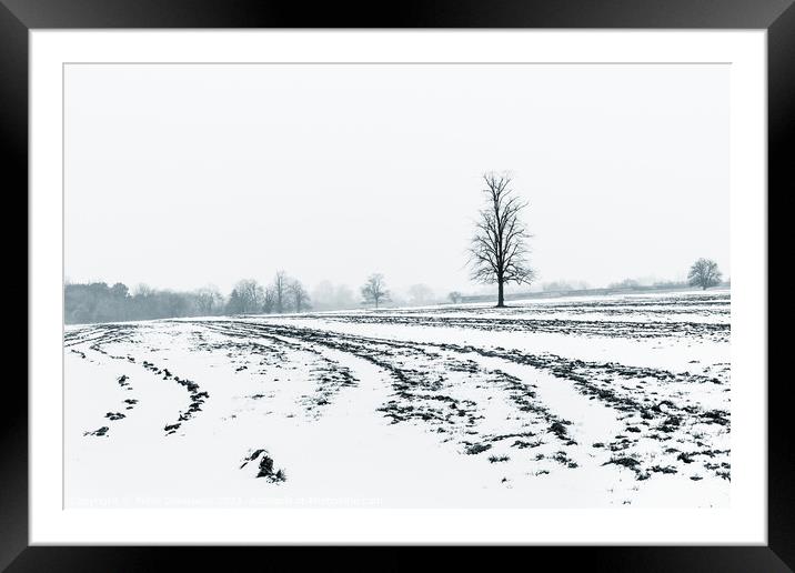Lone Tree Amid A Snow Covered Ploughed Field Framed Mounted Print by Peter Greenway