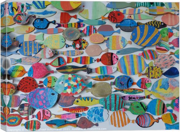 beautiful and colourful wooden fish wood craft on wall Canvas Print by Anish Punchayil Sukumaran