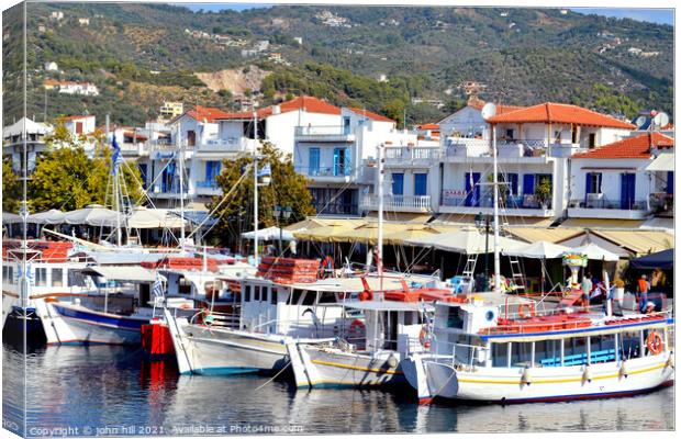 Ferries in the old port at Skiathos in Greece. Canvas Print by john hill
