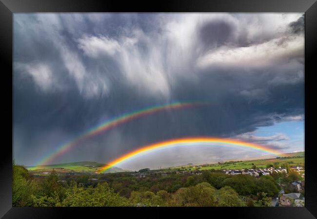 Dramatic skies over Derbyshire with double rainbow Framed Print by John Finney