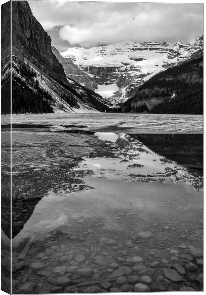 Frozen Lake, Alberta, Canada Canvas Print by Mark Llewellyn