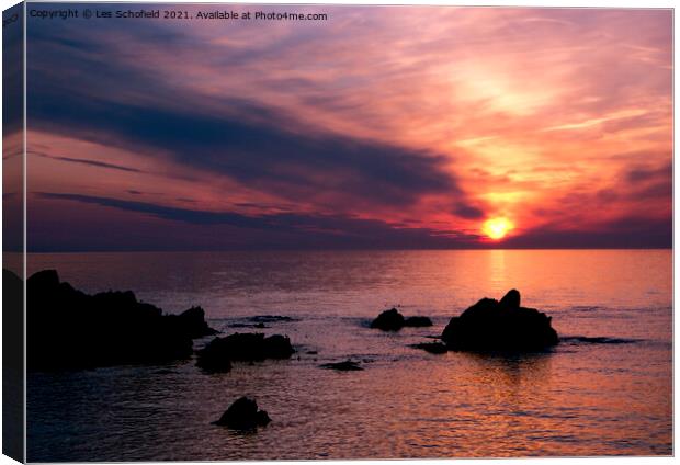 Sunset over Ilfracombe north devon  Canvas Print by Les Schofield