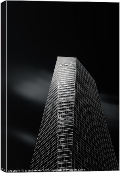 Skyscraper against black sky in Madrid Canvas Print by Juan Jimenez