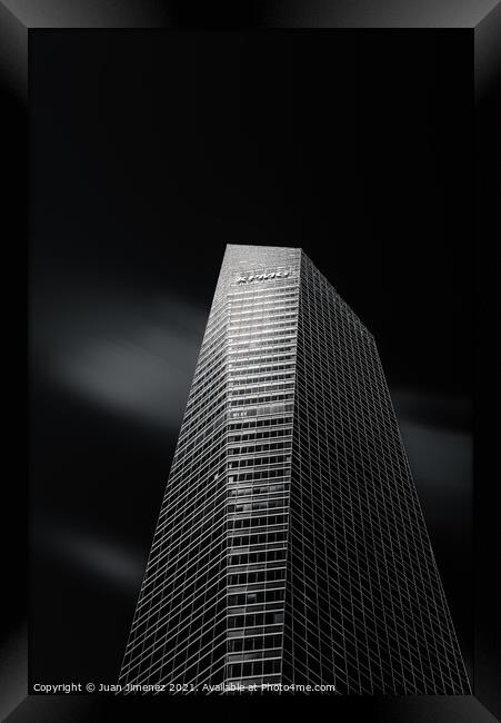 Skyscraper against black sky in Madrid Framed Print by Juan Jimenez