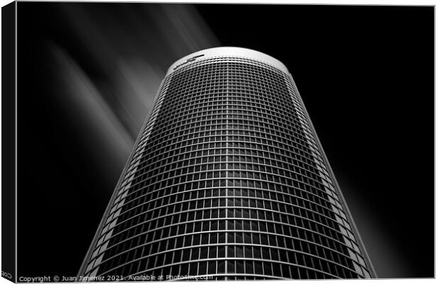 Low angle view of skyscraper against sky in Madrid Canvas Print by Juan Jimenez