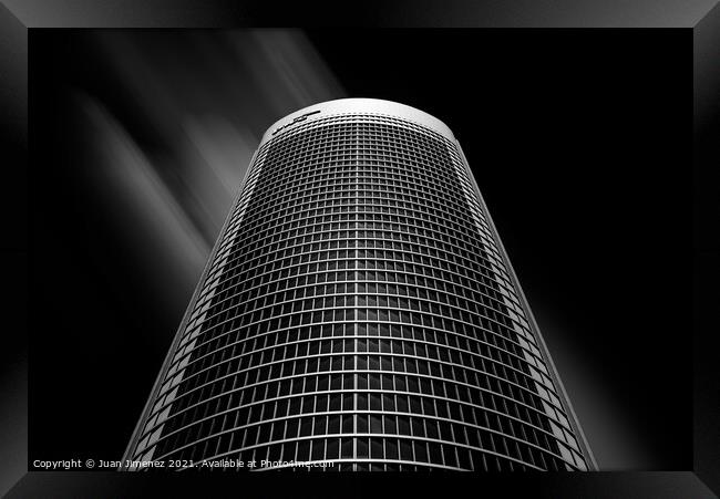 Low angle view of skyscraper against sky in Madrid Framed Print by Juan Jimenez