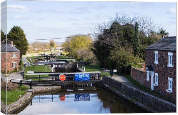 Locks on the Rufford branch of the Leeds Liverpool canal Canvas Print by Jason Wells