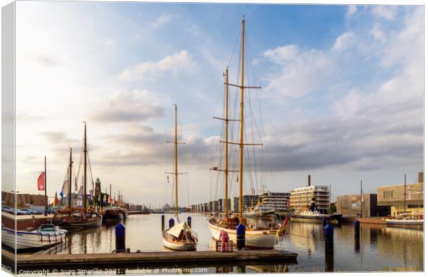 Scenic view of the port of Bremerhaven at sunset Canvas Print by Juan Jimenez