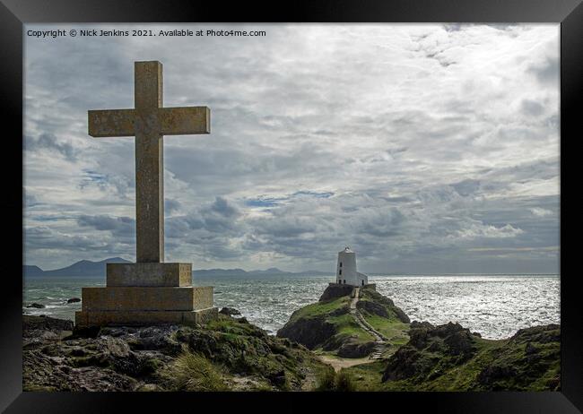 Cross overlooking the Lighthouse Llanddwyn Island Framed Print by Nick Jenkins