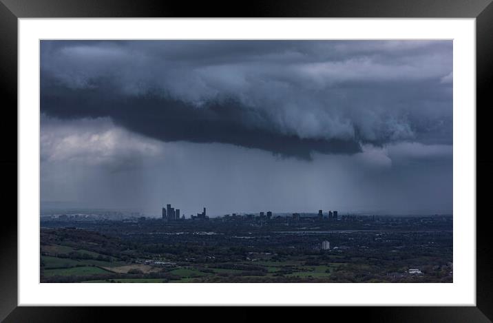 The City of Manchester under stormy skies Framed Mounted Print by John Finney