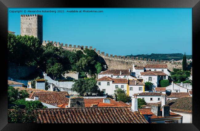 Narrow cobbled streets and traditionally painted houses in Obidos, Portugal. Framed Print by Alexandre Rotenberg