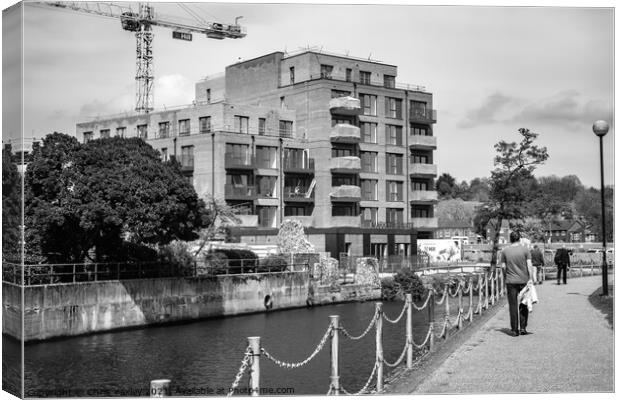 Flats under construction on the bank of the River Wensum, Norwich Canvas Print by Chris Yaxley