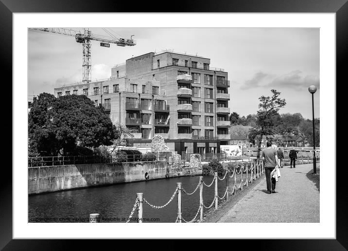 Flats under construction on the bank of the River Wensum, Norwich Framed Mounted Print by Chris Yaxley