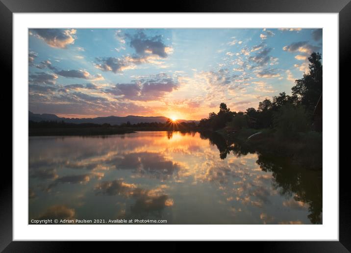 Sunset over a lake Framed Mounted Print by Adrian Paulsen