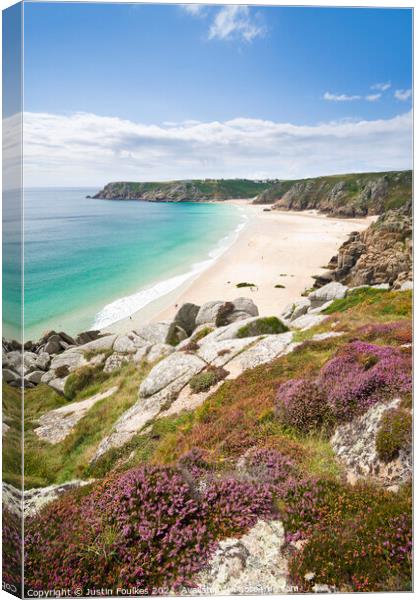 Porthcurno beach from the heather covered cliffs a Canvas Print by Justin Foulkes