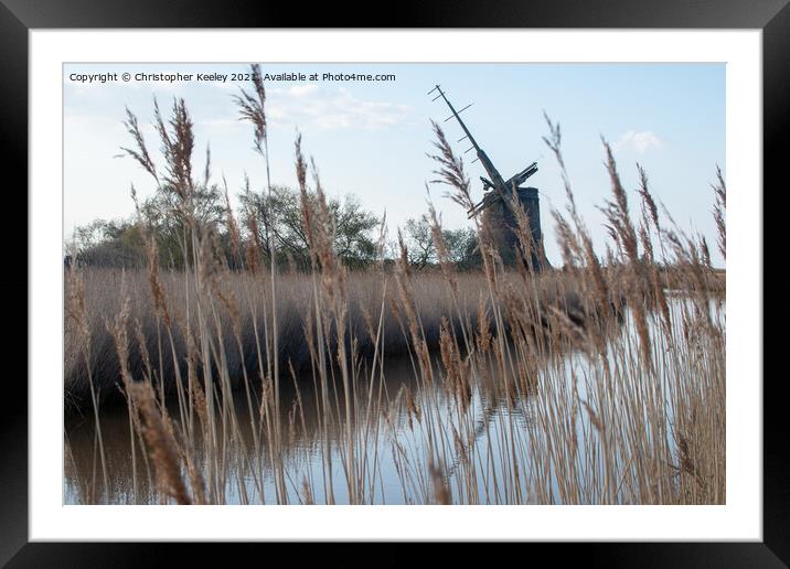 Brograve Mill through the reeds Framed Mounted Print by Christopher Keeley