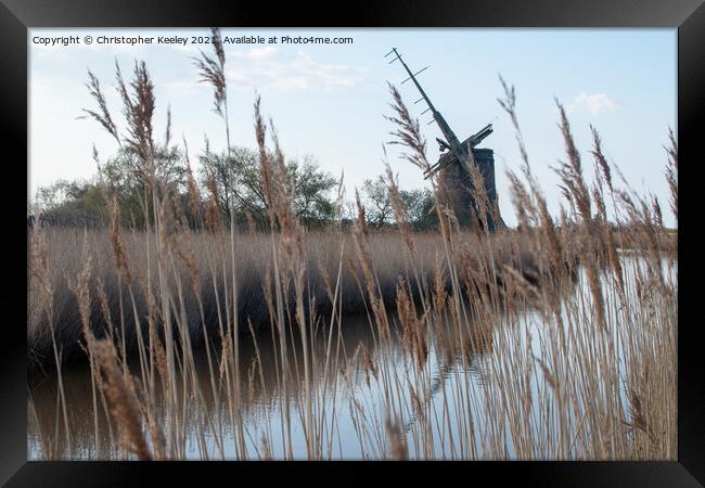 Brograve Mill through the reeds Framed Print by Christopher Keeley
