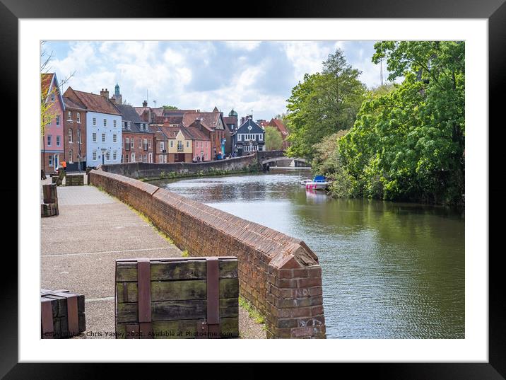 Norwich, Norfolk, UK – May 11 2021. The historic Quayside along the River Wensum in the city of Norwich, Norfolk. The traditional properties along this pedestrianised road have stunning interrupted views across the River Wensum all the way to Fye Bridge Framed Mounted Print by Chris Yaxley