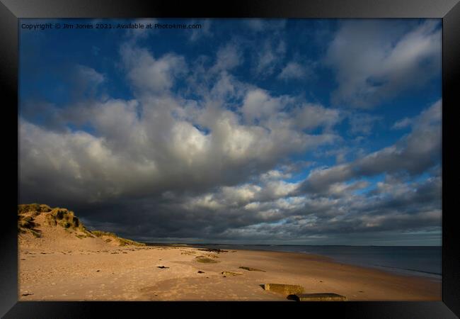 Druridge Bay under Threatening Clouds Framed Print by Jim Jones