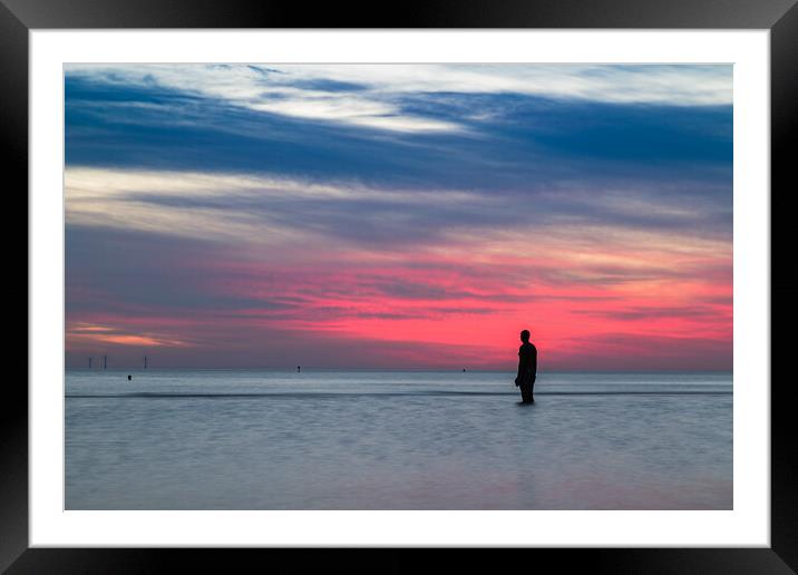 Red glow over an Iron Man Framed Mounted Print by Jason Wells