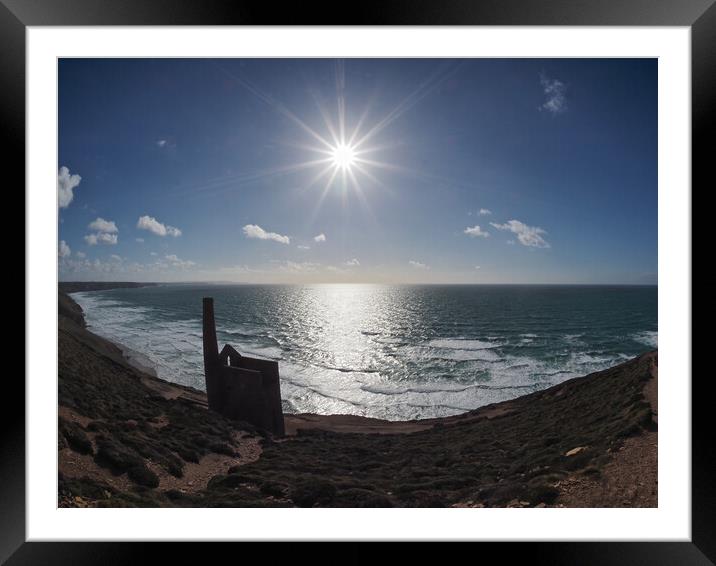 Sun shining over Wheal Coates ruins coast path Framed Mounted Print by mark humpage