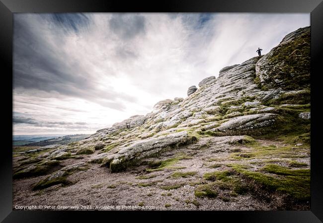 Man Stood Atop Of A Sloping Side Of Haytor Tor, Dartmoor Framed Print by Peter Greenway