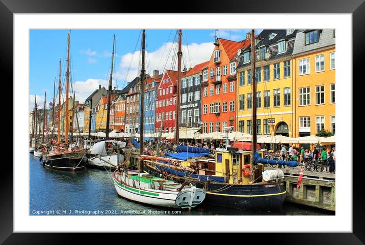 The boats, docked next to a body of water in Copen Framed Mounted Print by M. J. Photography