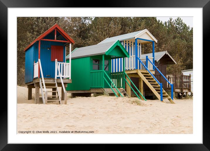 Colourful beach huts Framed Mounted Print by Clive Wells