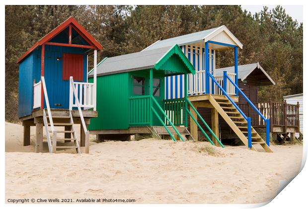 Colourful beach huts Print by Clive Wells
