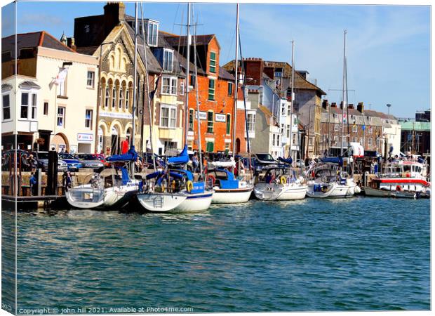 Moored yachts at Weymouth in Dorset. Canvas Print by john hill