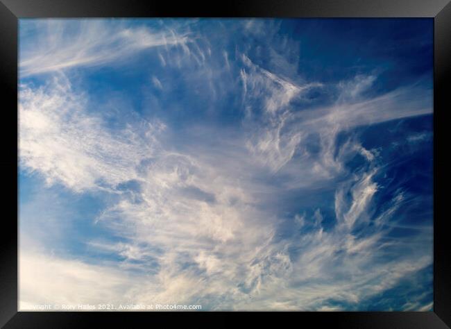 Cloud against a blue sky Framed Print by Rory Hailes