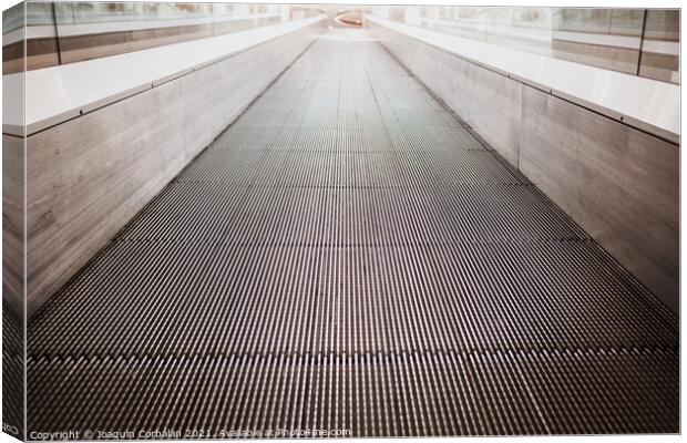 Flat escalator in a shopping mall without people, luminous unfoc Canvas Print by Joaquin Corbalan