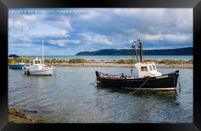 Afloat in Red Wharf Bay Anglesey Wales Framed Print by Pearl Bucknall