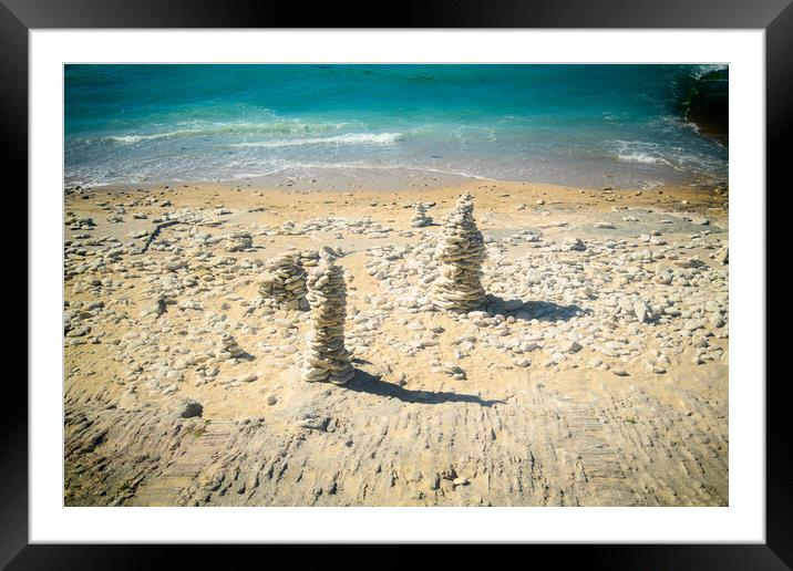 Pile of stones on the beach Framed Mounted Print by youri Mahieu
