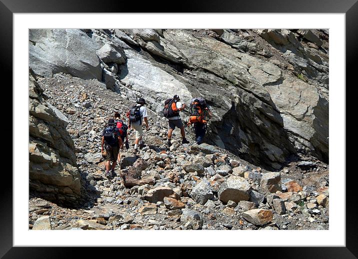 Trekkers Climbing over Landslide Framed Mounted Print by Serena Bowles