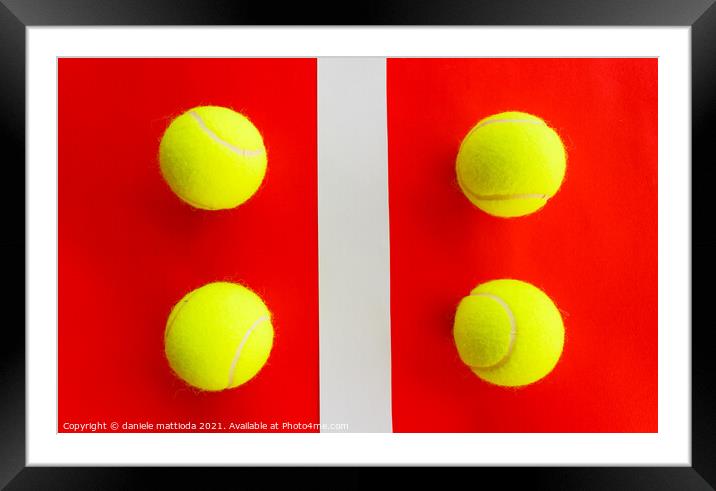 four tennis balls divided by a field line Framed Mounted Print by daniele mattioda