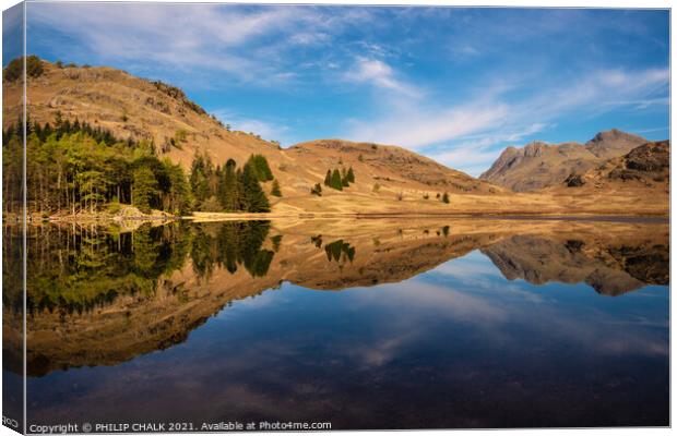 Blea tarn with mountain reflections in the lake district Cumbria. 511 Canvas Print by PHILIP CHALK