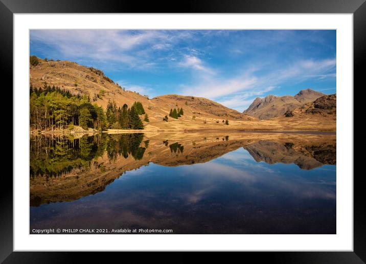 Blea tarn with mountain reflections in the lake district Cumbria. 511 Framed Mounted Print by PHILIP CHALK