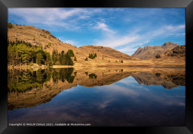 Blea tarn with mountain reflections in the lake district Cumbria. 511 Framed Print by PHILIP CHALK