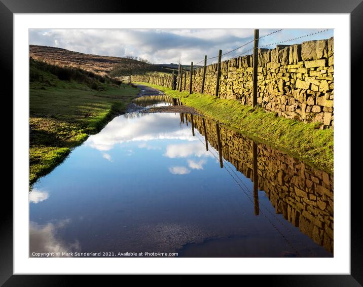 Puddles on the Bronte Way near Haworth Framed Mounted Print by Mark Sunderland