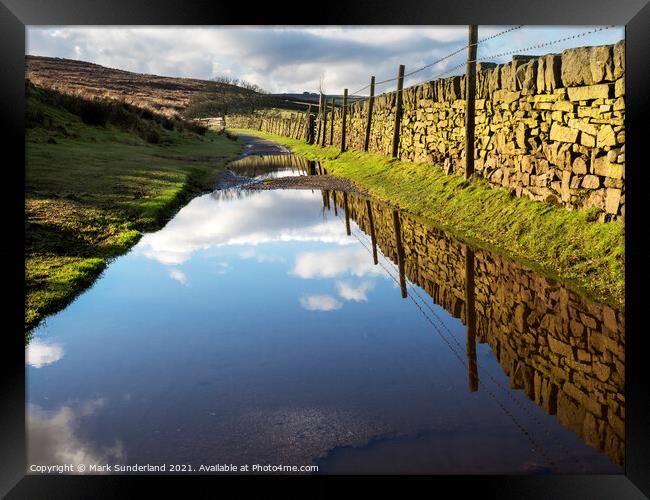 Puddles on the Bronte Way near Haworth Framed Print by Mark Sunderland