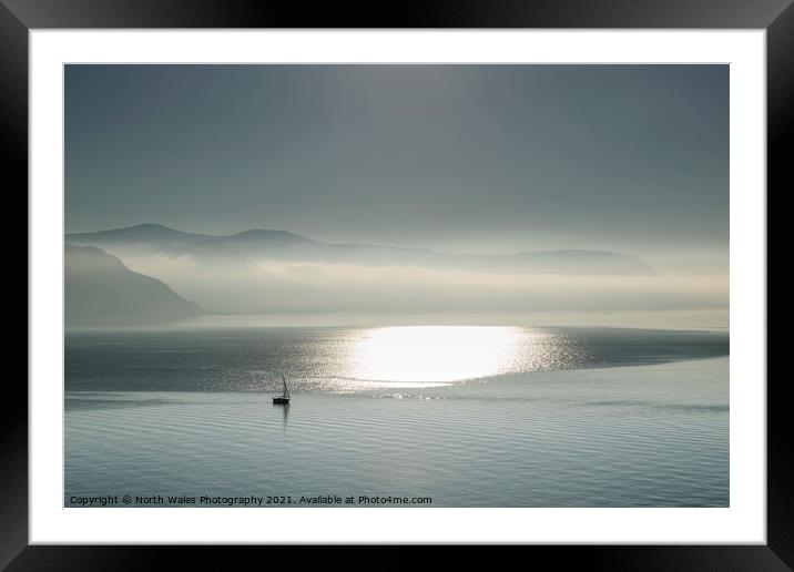 Lone yacht heading out in Conwy Bay Framed Mounted Print by North Wales Photography