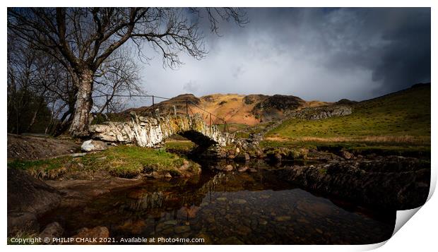 Moody Slaters bridge in the lake district Cumbria between rain and sleet showers.   517  Print by PHILIP CHALK