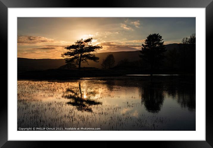 Dark sunset at Kelly hall tarn reflection in the l Framed Mounted Print by PHILIP CHALK