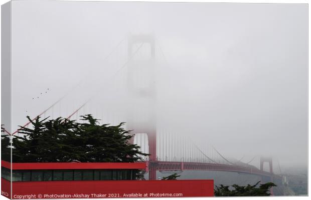 The Golden Gate Bridge partially covered under the Fogg. Canvas Print by PhotOvation-Akshay Thaker