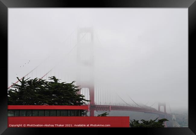 The Golden Gate Bridge partially covered under the Fogg. Framed Print by PhotOvation-Akshay Thaker