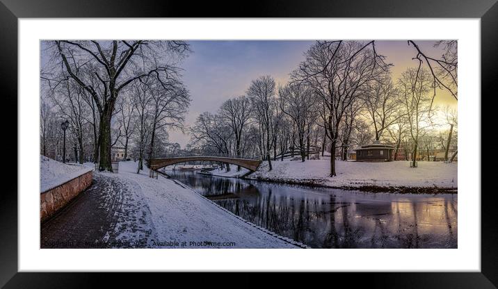 Sunset in snowy city park Framed Mounted Print by Maria Vonotna